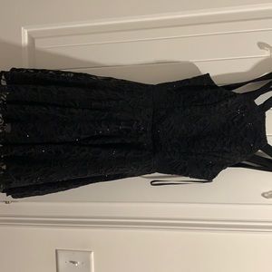 Black homecoming or party dress!! Is sparkly and a little fluffy on the bottom.